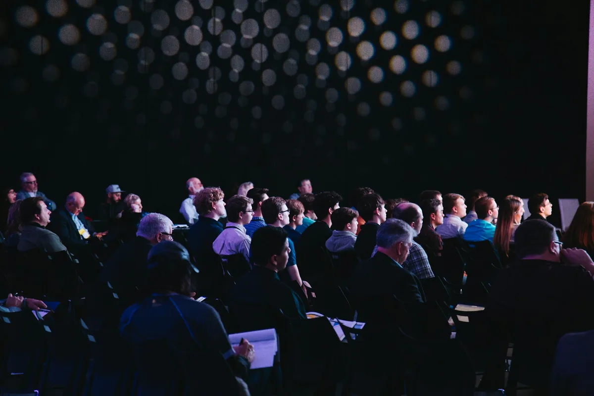 A conference auditorium, illustrating the event format